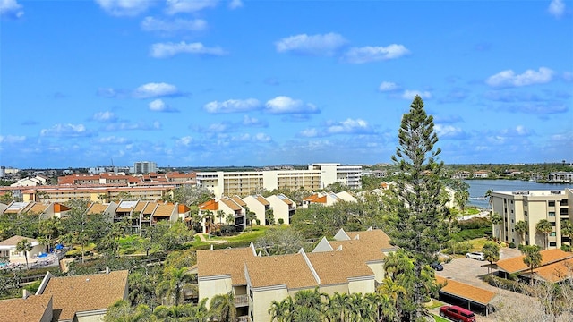 bird's eye view featuring a view of city and a water view