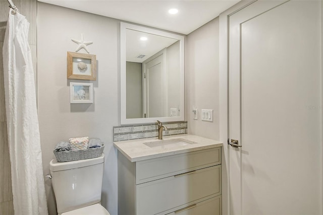 full bathroom featuring recessed lighting, toilet, and vanity