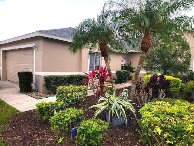 view of side of home featuring a garage