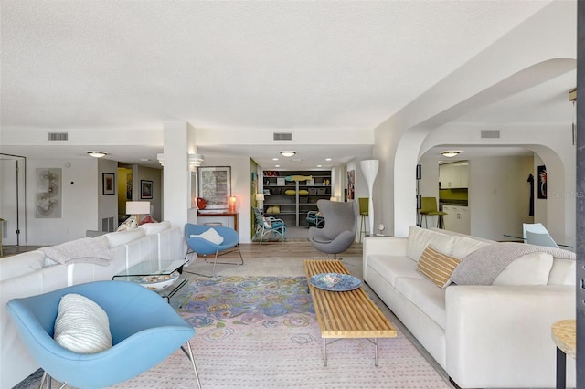 6415 Midnight Pass Rd Unit 211, Sarasota, FL 34242 - living room with arched walkways