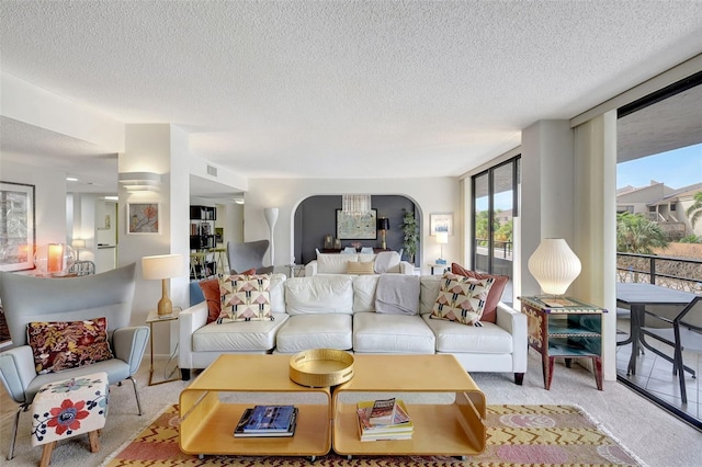 6415 Midnight Pass Rd Unit 211, Sarasota, FL 34242 - living room with a textured ceiling and arched walkways