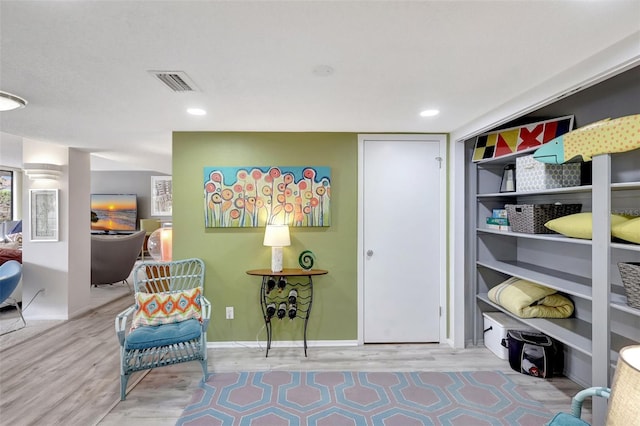 6415 Midnight Pass Rd Unit 211, Sarasota, FL 34242 - sitting room featuring wood finished floors, baseboards, and recessed lighting