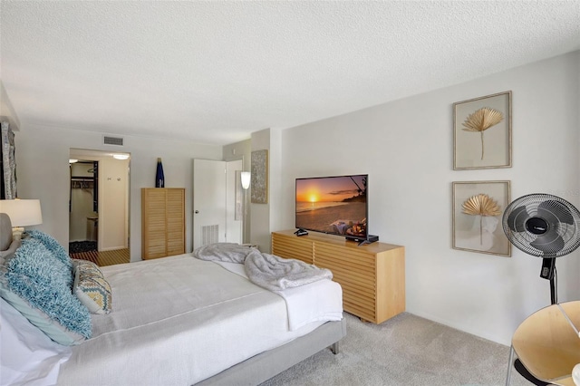 6415 Midnight Pass Rd Unit 211, Sarasota, FL 34242 - bedroom featuring light colored carpet and a textured ceiling