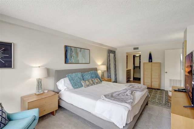 6415 Midnight Pass Rd Unit 211, Sarasota, FL 34242 - carpeted bedroom with a textured ceiling