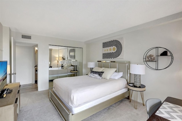 6415 Midnight Pass Rd Unit 211, Sarasota, FL 34242 - bedroom featuring carpet floors, baseboards, and a closet