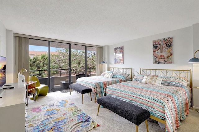 6415 Midnight Pass Rd Unit 211, Sarasota, FL 34242 - carpeted bedroom with access to outside and floor to ceiling windows