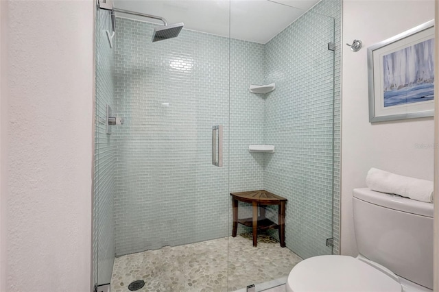 6415 Midnight Pass Rd Unit 211, Sarasota, FL 34242 - bathroom with toilet, a shower stall, and tile patterned flooring