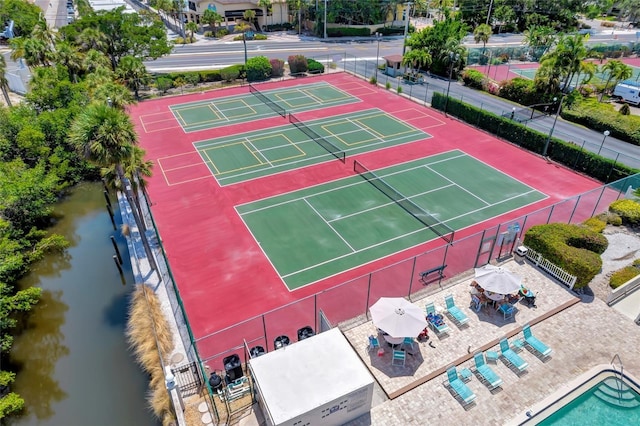 6415 Midnight Pass Rd Unit 211, Sarasota, FL 34242 - view of tennis court featuring a water view