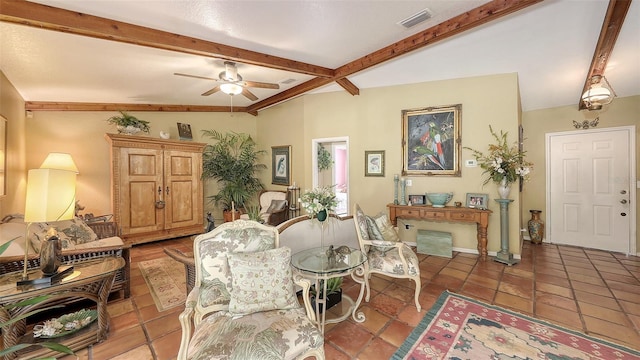 interior space with light tile patterned floors, ceiling fan, visible vents, and beamed ceiling