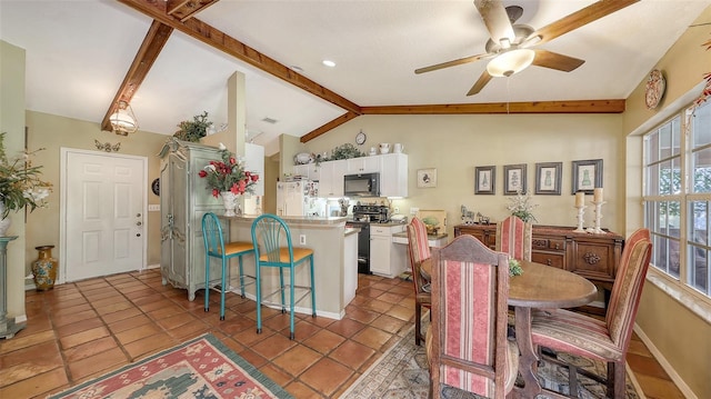 tiled dining room featuring a ceiling fan, vaulted ceiling with beams, and baseboards