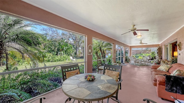 sunroom with a ceiling fan