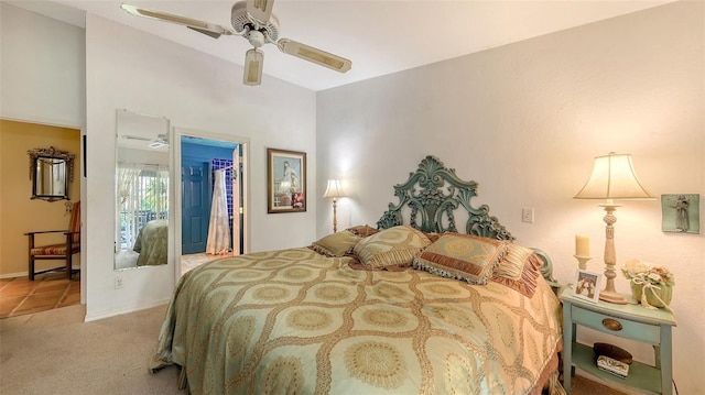 bedroom featuring ceiling fan, baseboards, a closet, carpet, and a walk in closet