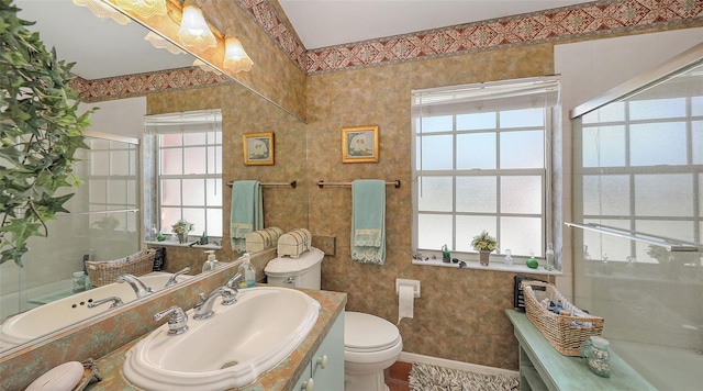 bathroom featuring baseboards, vanity, toilet, and an enclosed shower