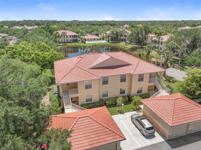 drone / aerial view with a water view