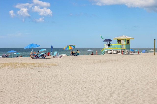 property view of water featuring a beach view