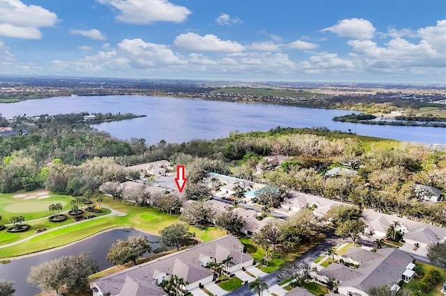 birds eye view of property with a water view and view of golf course