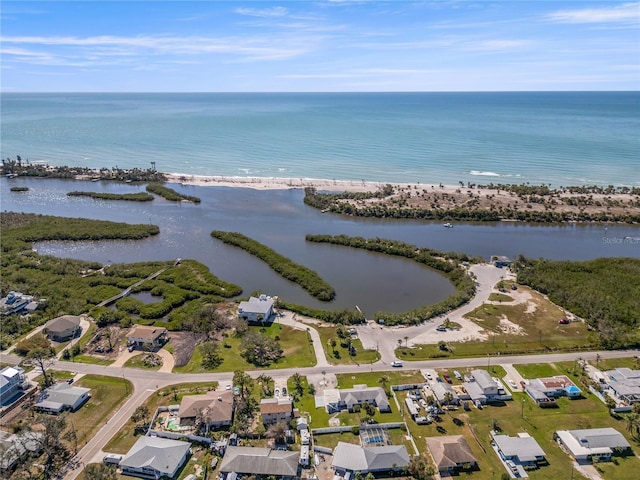 drone / aerial view with a residential view and a water view