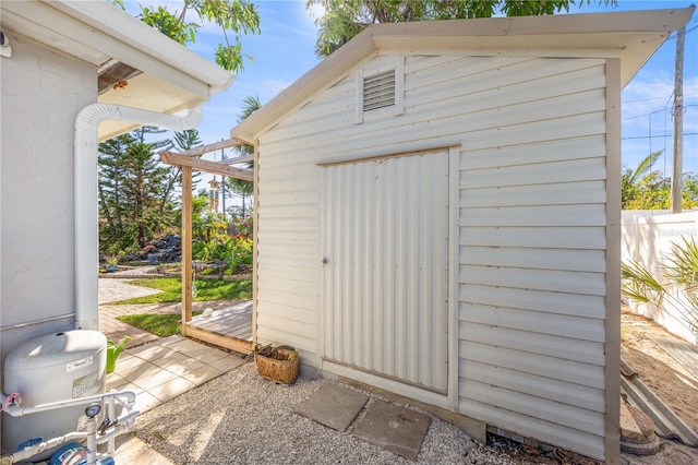 view of shed with fence