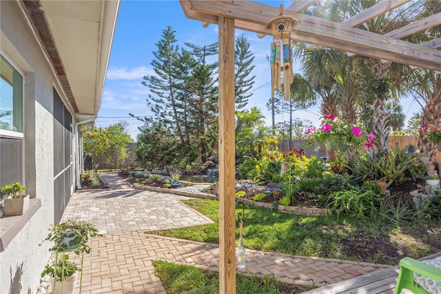 view of patio / terrace with a fenced backyard and a pergola