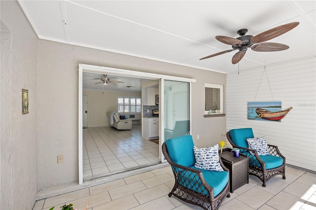 view of patio featuring a ceiling fan