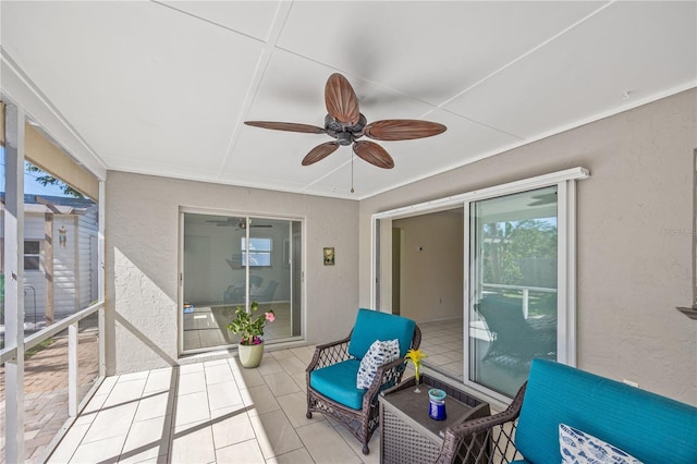 sunroom with a ceiling fan