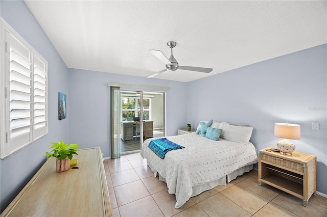 bedroom with access to outside, ceiling fan, baseboards, and light tile patterned floors