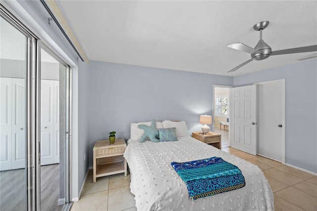 bedroom with light tile patterned floors, baseboards, visible vents, and a ceiling fan