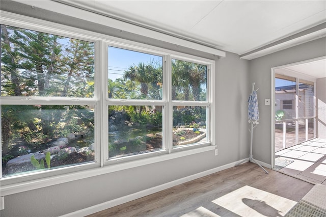 spare room with light wood-style floors and baseboards