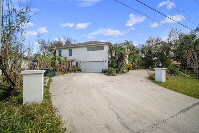 view of side of home featuring a garage