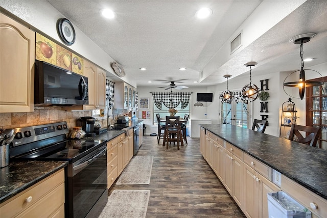 kitchen with sink, hanging light fixtures, electric range, dark hardwood / wood-style floors, and a textured ceiling