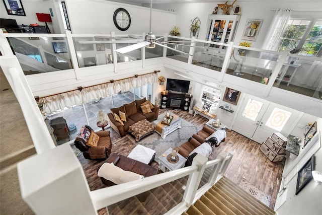 living room featuring ceiling fan and wood-type flooring