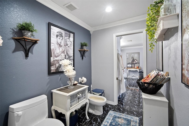 bathroom featuring a bidet, ornamental molding, and toilet