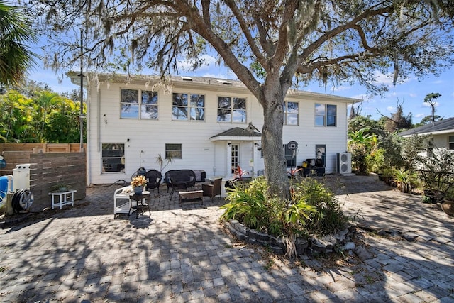 view of front of home with an outdoor living space and a patio area