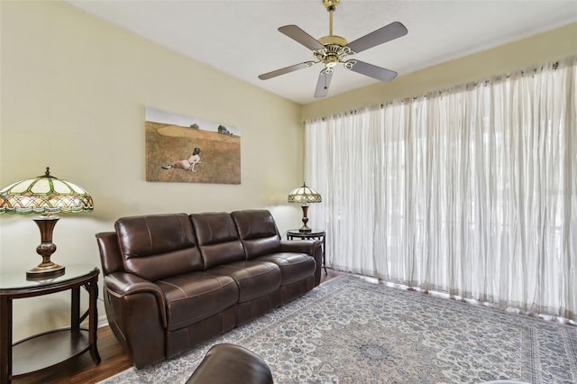 living room with a ceiling fan and wood finished floors