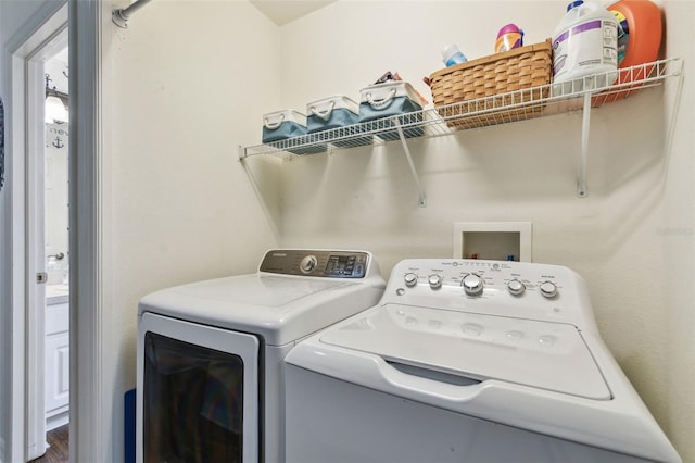 clothes washing area with laundry area and washing machine and clothes dryer