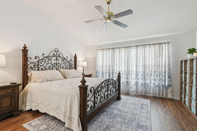 bedroom featuring vaulted ceiling, ceiling fan, and dark wood-type flooring