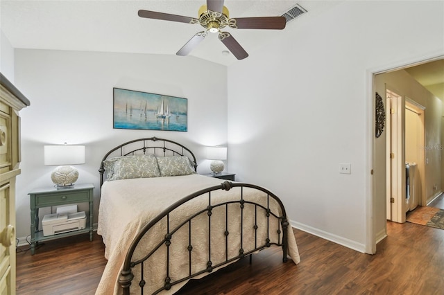 bedroom with dark wood-style floors, lofted ceiling, visible vents, ceiling fan, and baseboards