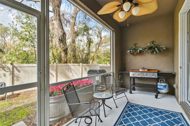 sunroom / solarium with ceiling fan