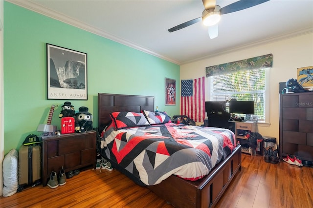 bedroom with ceiling fan, ornamental molding, and hardwood / wood-style floors