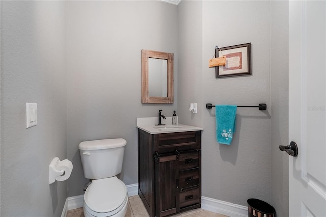 bathroom with vanity, tile patterned floors, and toilet