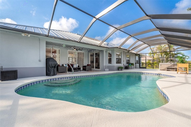 view of pool with ceiling fan, a lanai, an outdoor hangout area, and a patio area