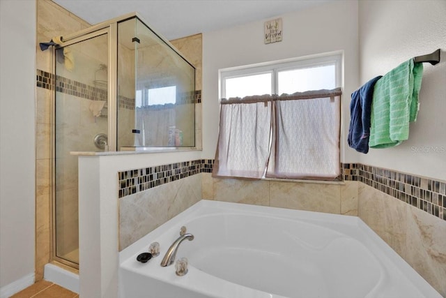 bathroom featuring plus walk in shower