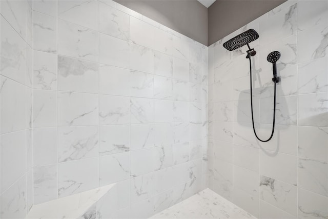 bathroom with a tile shower