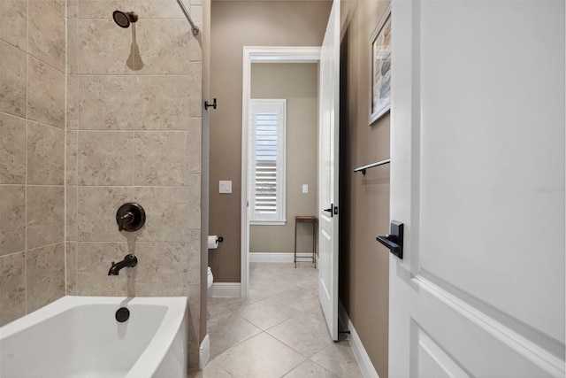 full bath featuring tile patterned flooring, baseboards, and shower / bathtub combination