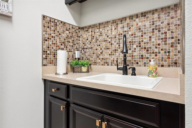 bathroom featuring backsplash and vanity