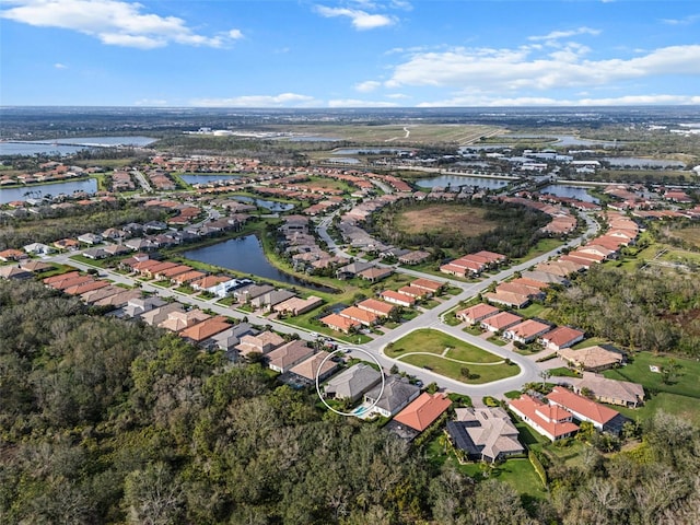 aerial view featuring a water view and a residential view