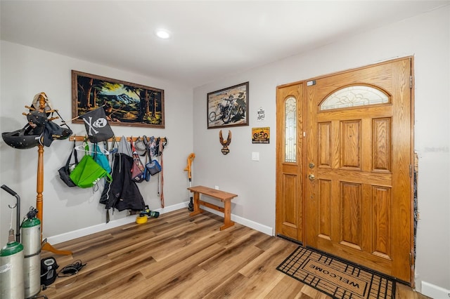 entryway featuring light wood finished floors and baseboards