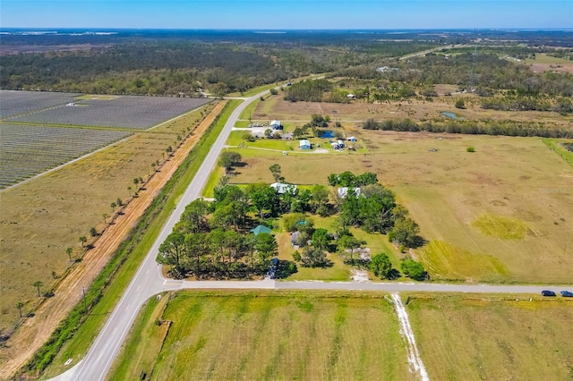 birds eye view of property with a rural view