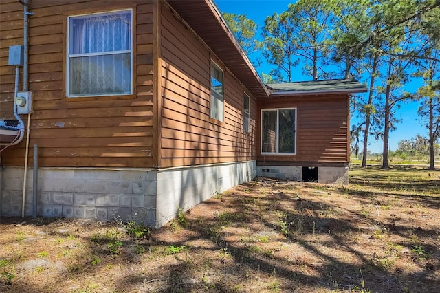 view of property exterior with crawl space