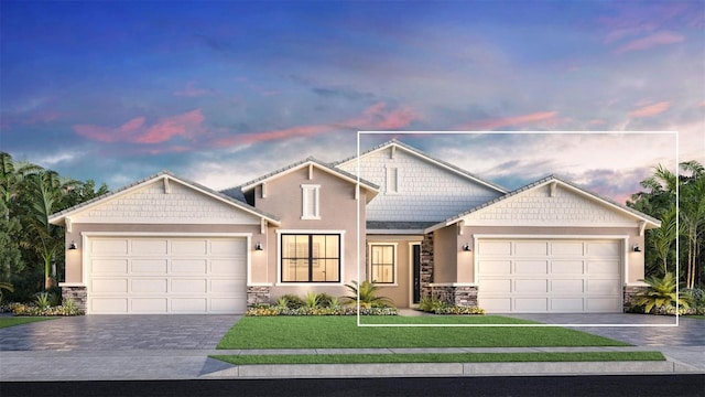 view of front of home with a garage and a lawn